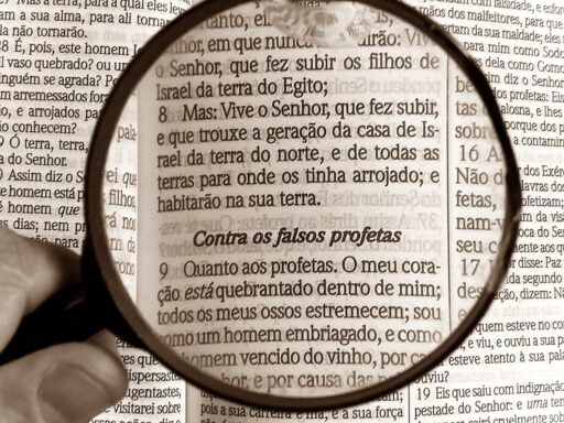 Magnifying glass focusing on the pages of the Bible