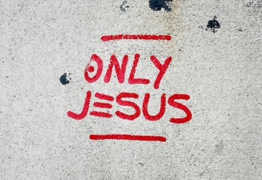 Red writing that says Jesus is God which shows the deity of Christ