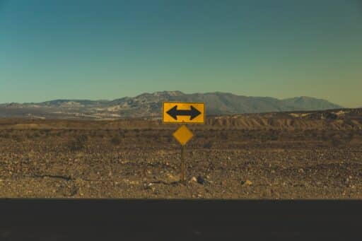 yellow arrow road sign which shows moral relativism
