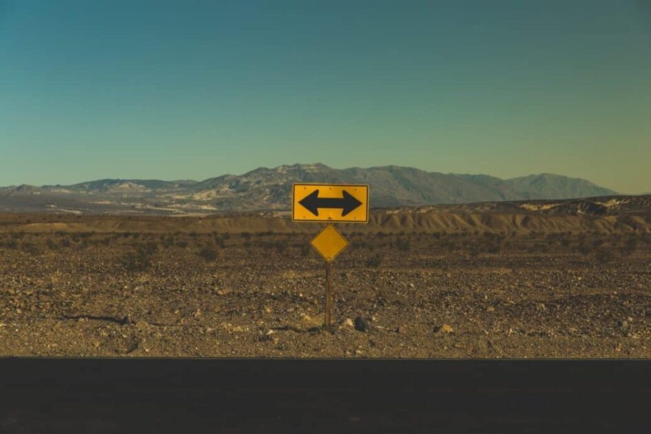 yellow arrow road sign which shows moral relativism